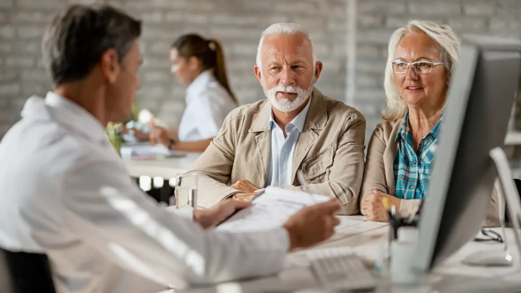 Clients discussing their income tax return with a tax expert