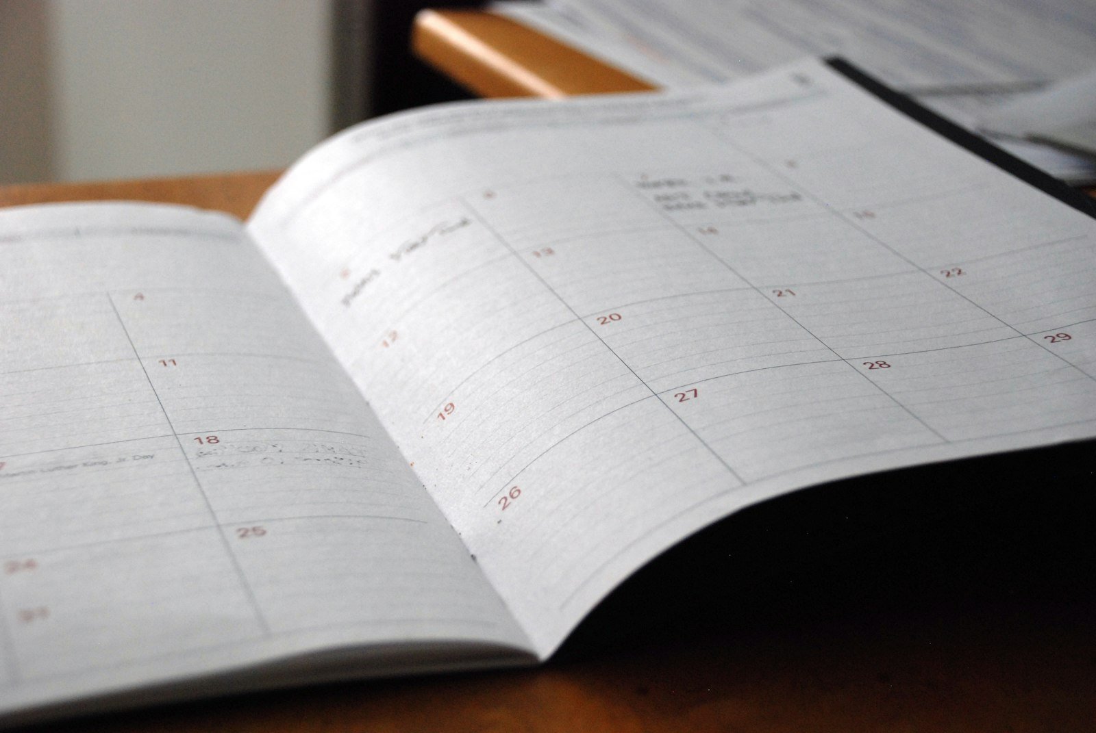 Monthly planner open on a desk — tax due dates calendar